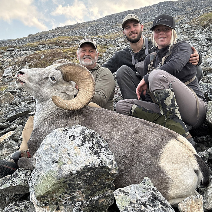 Hunter and guides with a Stone's sheep